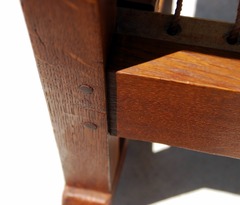 Double pinned mortise and tenon joinery where front seat rail meets the leg. 